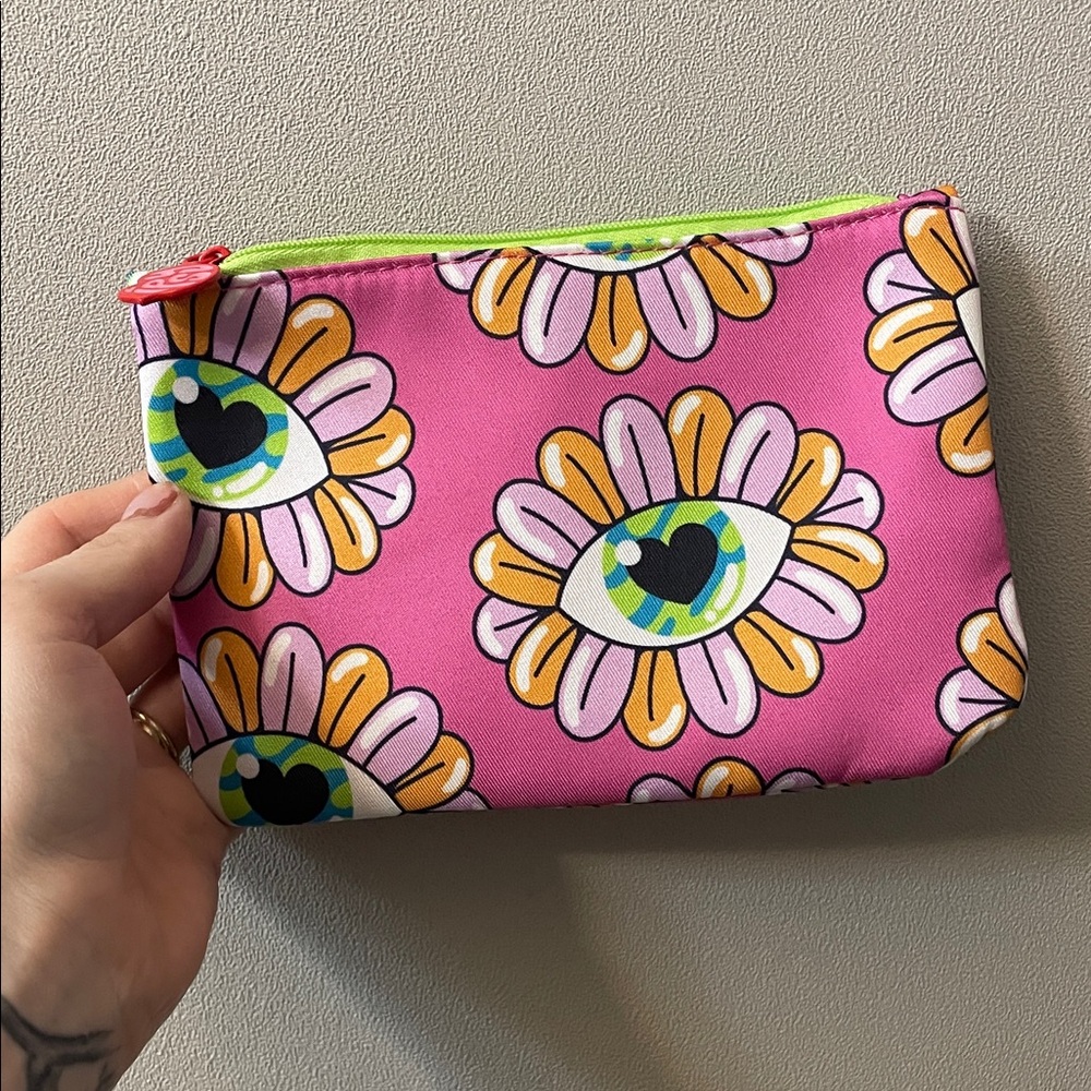 FREE WITH 5/$25 MAKEUP PURCHASE! June 2025 Vibrant Heart Pattern Pouch